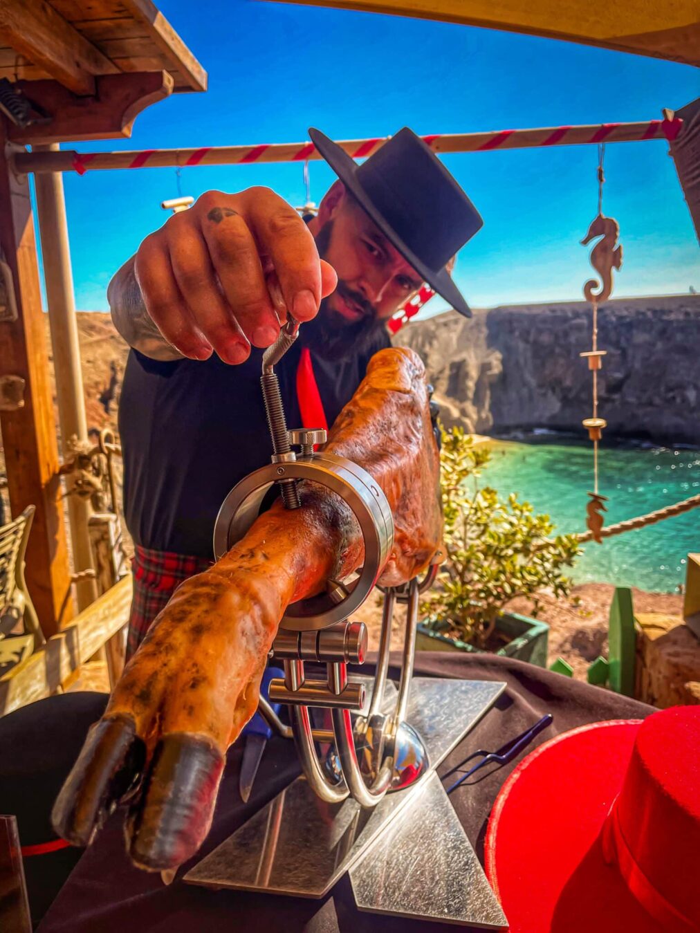 Ruta del Jamón por Canarias – Galician Ham Carver Jamón ibérico sobre una playa de Canarias – Ruta del Jamón por Canarias
